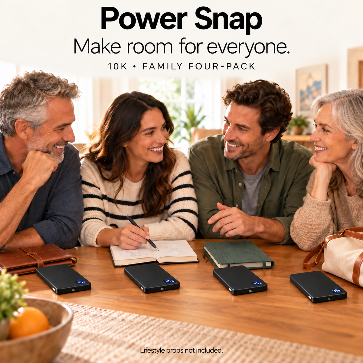 Four Power Snap 10K banks on a household table, digital displays showing charge percentage. Lifestyle props not included.