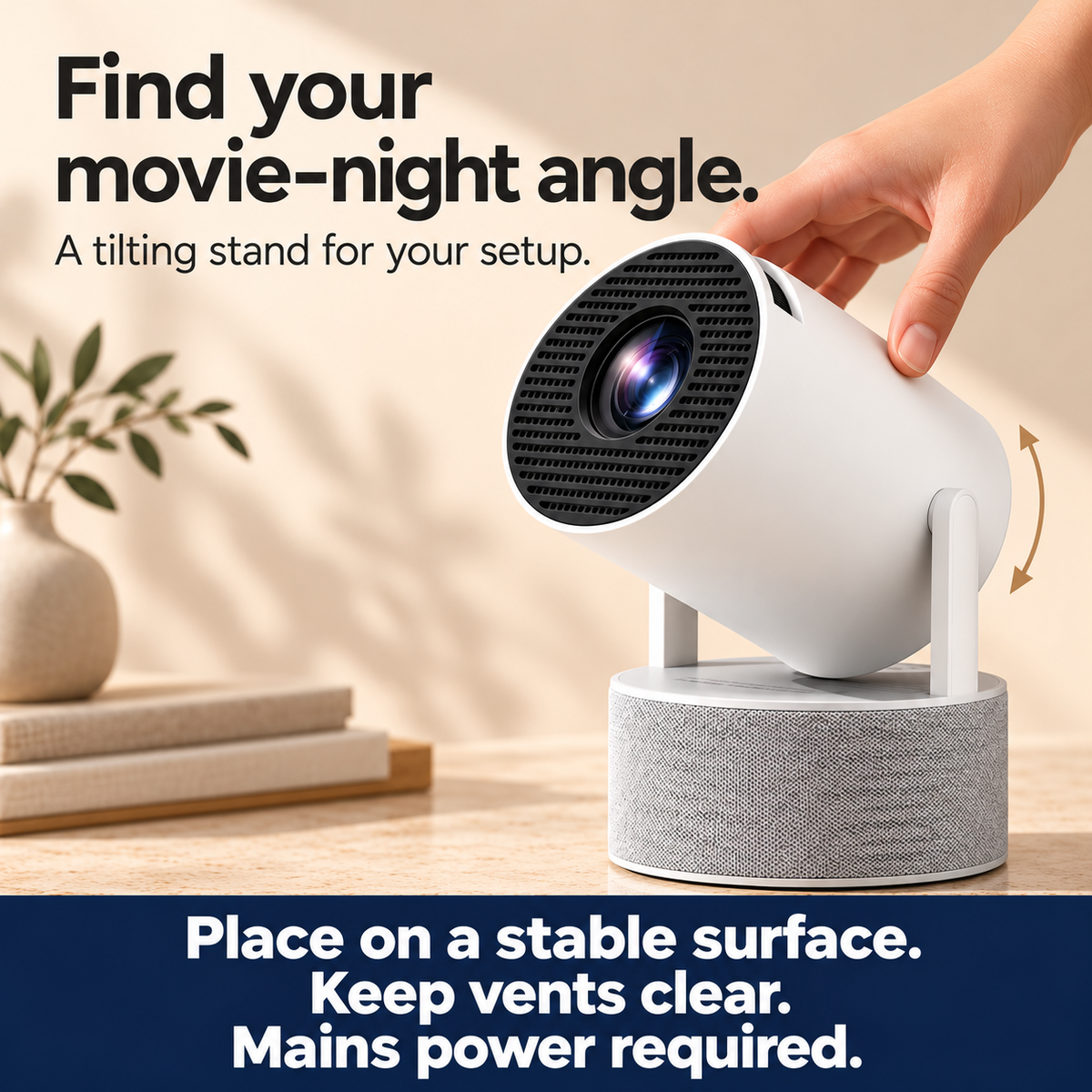 A hand adjusts the karaoke projector on its tilting stand above the grey speaker base.