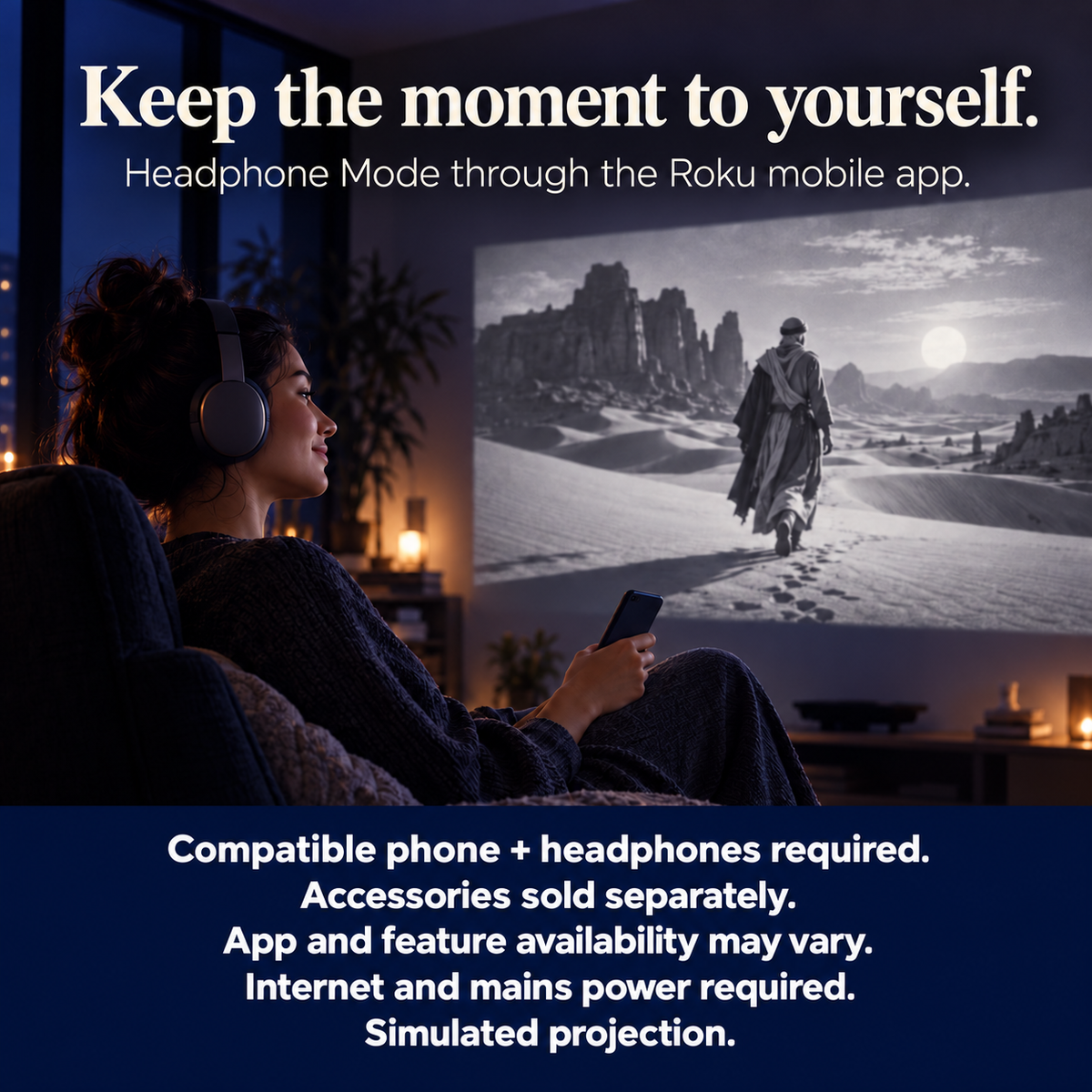 An adult uses compatible headphones and a phone while viewing a simulated projection.