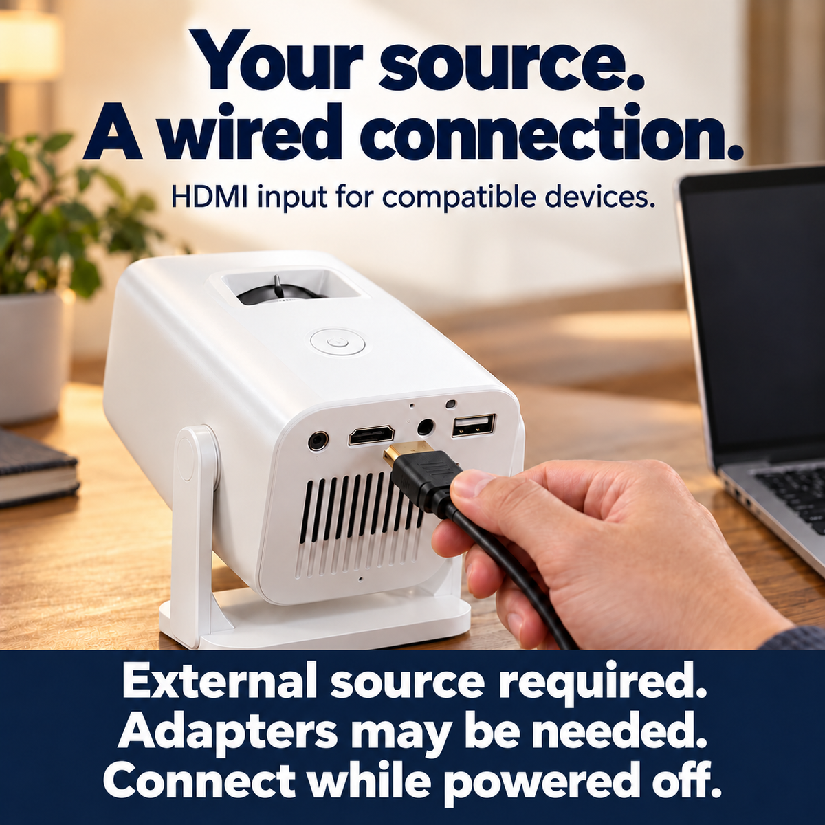 A hand prepares to connect an HDMI cable to the powered-off projector.